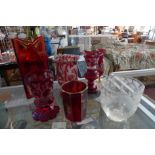 A collection of finely cut cranberry glass