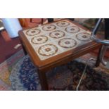 A mid 20th century teak G-plan coffee table, with tiled top, H.37 W.72 D.72cm