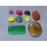 A collection of loose gemstones, to include an oval cut ruby, and an oval cut emerald, (9)