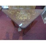 A 19th century marquetry inlaid folding games table with chequered games top, fluted tapered legs