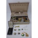 A large collection of costume jewellery comprising a Trifari necklace, vintage brooches,