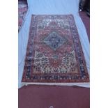 A North West Persian Nahawand rug, central floral jade medallion with repeating floral motifs on a