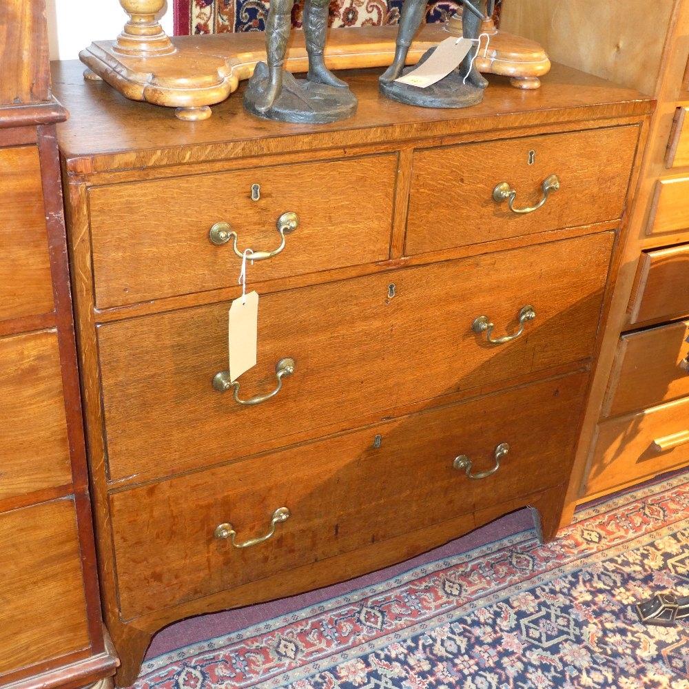 A Georgian oak chest of two short over two long drawers, raised on bracket feet, H.90 W.92 D.46cm