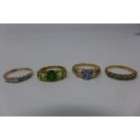 Four ladies 9ct yellow gold dress rings, one inset with lima quartz and peridot, others stone