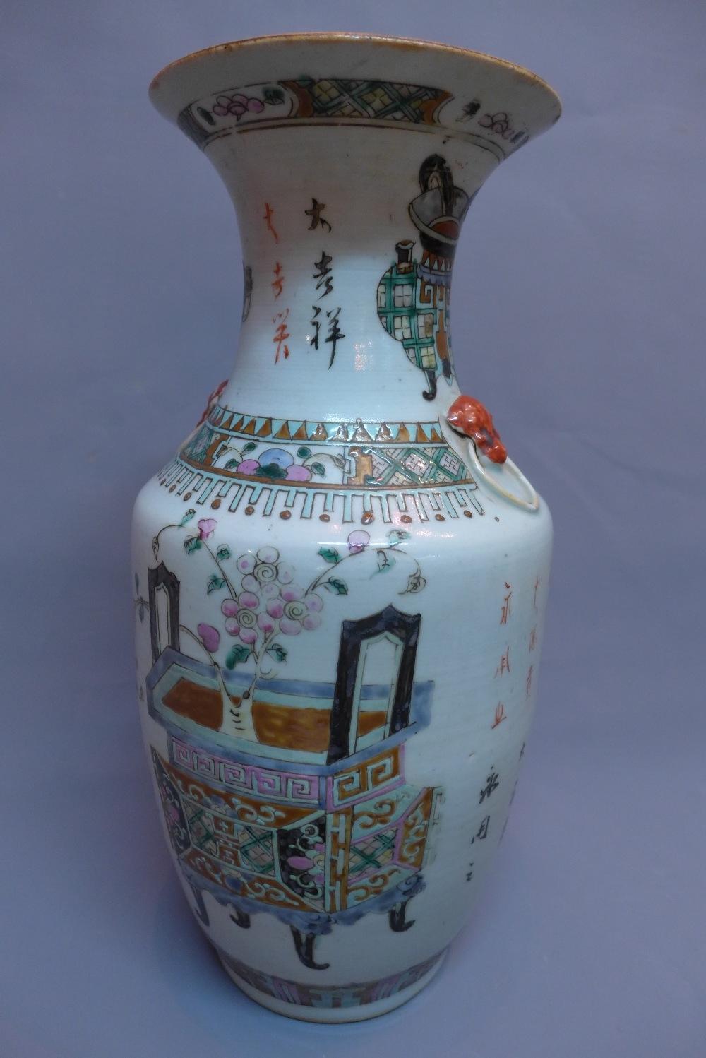 A 19th century Chinese porcelain baluster vase, decorated with cloisonne vases and character