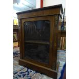 A Victorian walnut, marquetry inlaid and ormolu mounted pier cabinet with glass door, raised on