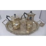 A Charles Edwards Arts and Crafts silver five piece tea set comprising a tea pot, water pot, sugar