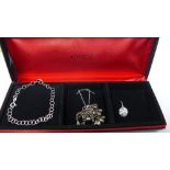 A cased set of Macy's silver jewellery, comprising a bracelet, a necklace and a pair of earrings,