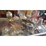 A collection of silver plated ware, to include teapots, a three sconce candelabra, serving spoons, a