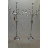 A pair of floor standing chrome candelabras with four branches, H.150cm