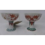 A pair of Chinese Republican period porcelain stem cups, c.1920, hand painted with dragons chasing