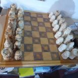 A large chessboard, bamboo border on a pine board with leather squares, 69 x 69cm, together with