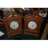 Two oak mantel clocks, broken swan neck pediments with turned finial above Ionic columns, Arabic