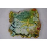 An Irish abstract ceramic plaque, signed, together with a studio pottery tile titled 'Back to the