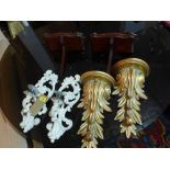 A pair of Continental painted wall sconces, along with a pair of giltwood wall brackets, and another