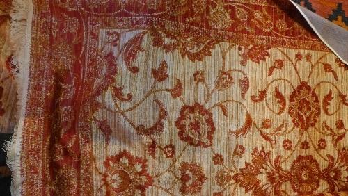 A Ziegler style carpet, with floral design on a beige ground, contained by floral border, 230 x