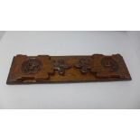 A 19th century carved oak book slide