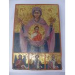 A Russian icon, Mother of God of the Sign, with an angel and two saints below, tempera on wood