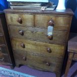 A 19th century elm chest with two short over three long drawers, raised on shaped bracket feet, H.