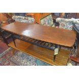 A mid 20th century teak coffee table, raised on ebonised base, H.46 W.136 D.50cm