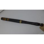 A Victorian police truncheon, ebonised and painted with boar head crest and crown, H.50cm