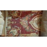 An early 20th century Aubusson design runner, the foliate design on terracotta ground within a