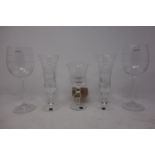 A pair of Cumbria crystal champagne flutes and a Cumbria crystal wine glass, together with a pair of