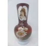 WITHDRAWN- A Bohemian glass vase with elongated neck, decorated with a printed bust of lady,