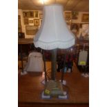 An Edwardian brass Corinthian column form table lamp with tasseled shade