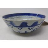 A late 19th century Chinese blue and white bowl, decorated with boats, bears four character marks,
