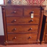 A William IV mahogany chest, with two short over three long drawers, flanked by columns with