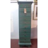 A green painted teak pedestal chest of ten drawers, raised on bracket feet, H.135 W.41 D.47cm