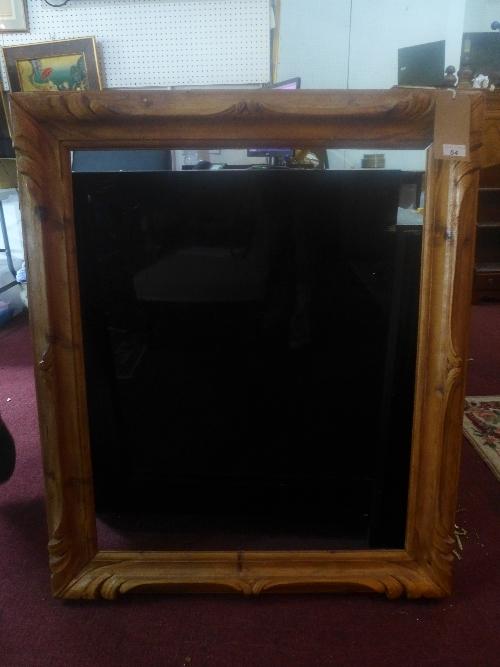 An early 20th century Continental carved pine frame, H.102cm W.84cm