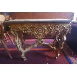 A mid 20th century Rococo style giltwood console table, having marble top on carved C-scroll legs