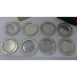 Two sets of twelve Mexican silver coasters, stamped 900, 63oz