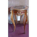 An early 20th century Louis XV style walnut lamp table, with marquetry inlay, having ormolu