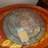 A large Tibetan copper charger, decorated with deities and scrolling foliage, Diameter 40cm,