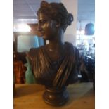 A bronzed cast resin bust of Diana the goddess of the hunt, raised on socle base, H.76cm