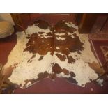 A contemporary cow hide rug