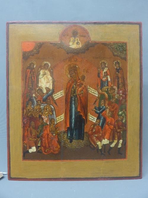 A Russian icon, 'The Mother of God, joy to all who grieve', tempera on wood panel, 34.5 x 29.5cm