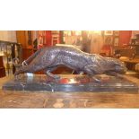 A bronze jaguar, raised on a stepped rectangular marble base, H.18 L.63cm