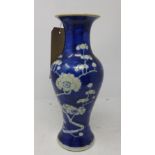 A 19th century Chinese blue and white porcelain vase, decorated with prunus and four character marks