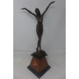 An Art Deco style bronze study of a dancer, raised on marble base, H.53cm