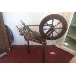 An early 20th century spinning wheel, H.80cm