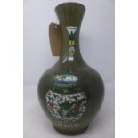 A Chinese speckled green ground porcelain vase, decorated with various vases, bearing character