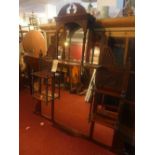 An Edwardian carved oak overmantel mirror with marginal plates and shelves, H.132cm W.130cm