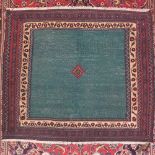 A North East Persian Safreh kilim, central diamond medallion on a green field within stylised