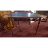 A mid-century Gordon Russel teak corner writing table, with a black vinyl insert over central frieze