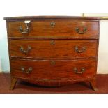 A Georgian mahogany bow front chest of three graduating drawers, raised on splayed legs, H.79 W.