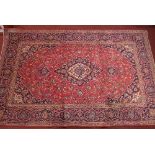 A fine Central Persian Kashan carpet, double pendent medallion with repeating petal motifs on a